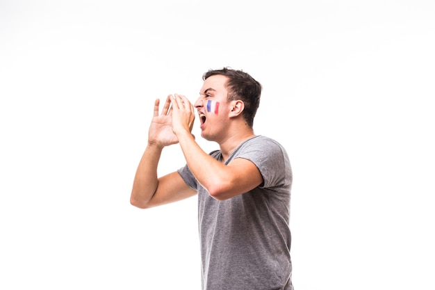 Portrait of France football fan scream laud support France national team on white background. Football fans concept.