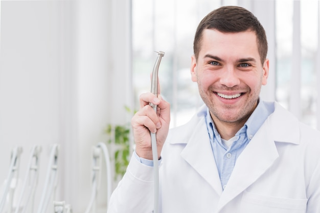 Portrait of friendly dentist