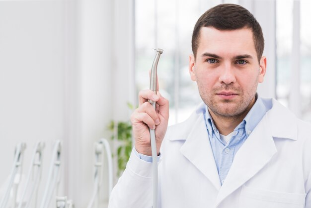 Portrait of friendly dentist