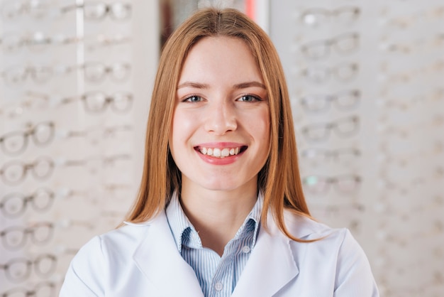 Portrait of friendly female optometrist