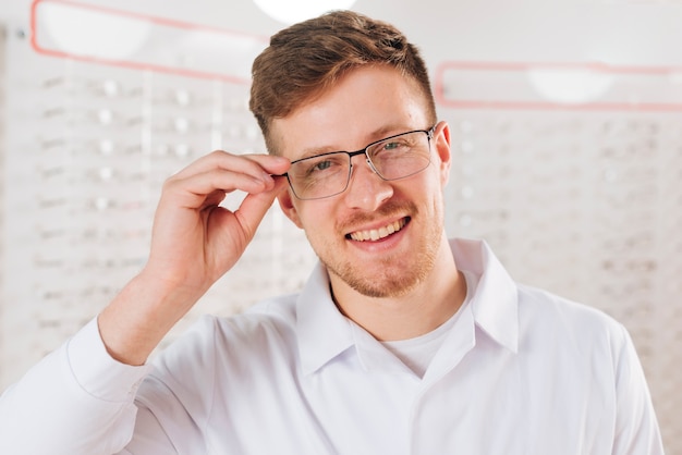 Portrait of friendly male optometrist