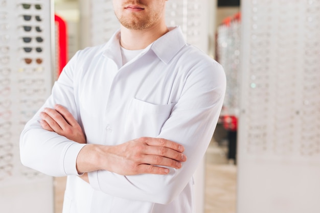 Portrait of friendly male optometrist