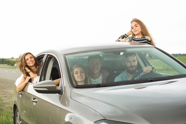 Portrait of friends enjoying the road trip at outdoors