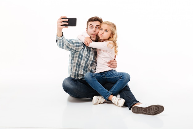 Portrait of a funny father and his little daughter