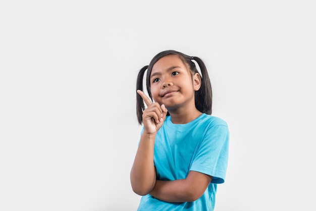 Free photo portrait of funny little girl acting in studio shot