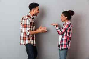 Free photo portrait of a furious young african couple having a quarrel