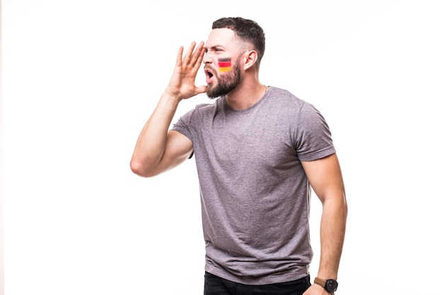 Portrait of Germany football fan scream support Germany national team on white background. Football fans concept.