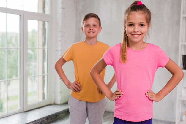 Portrait of a girl and boy looking at camera