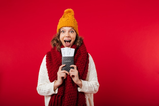 Portrait of a girl dressed in winter hat and scarf