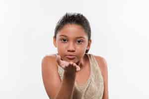 Free photo portrait of a girl gesturing flying kiss against white backdrop