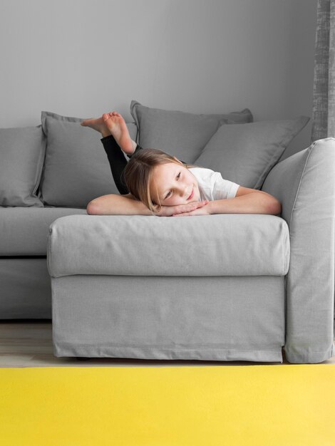 Portrait girl at home on couch