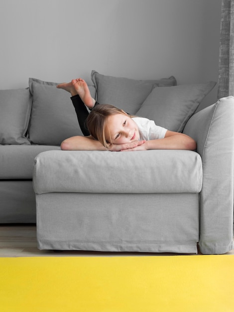 Portrait girl at home on couch