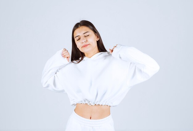 Portrait of girl model posing and posing with closed eyes .