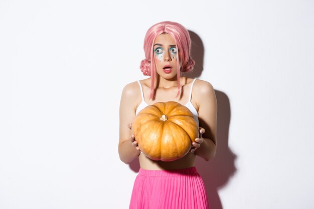 Portrait a girl in a pink short wig