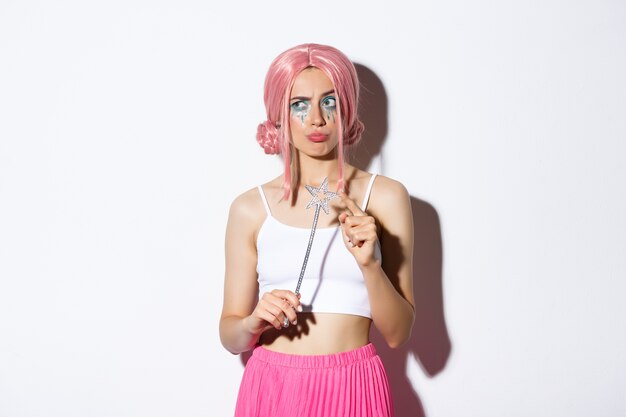 Portrait a girl in a pink short wig