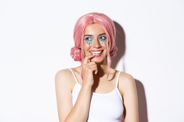 Portrait a girl in a pink short wig