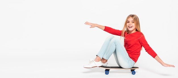 Portrait girl riding skateboard