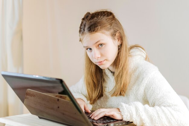 Portrait of a girl using laptop