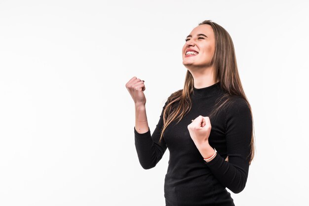 Portrait of a girl victory concept in a dark dress Isolated over white