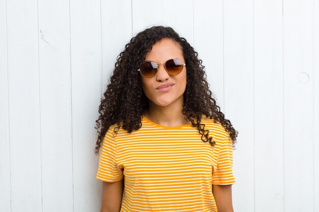 Portrait of a girl on a white wooden background