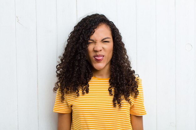 Portrait of a girl on a white wooden background