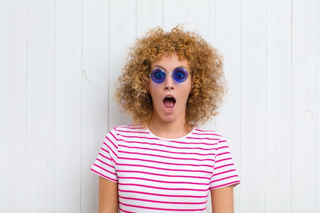 Portrait of a girl on a wooden background