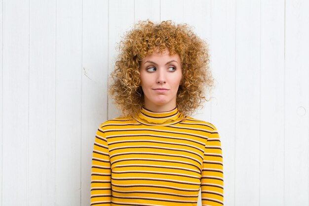 Portrait of a girl on a wooden background