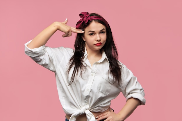 Free photo portrait of gorgeous pin up girl wearing white shirt and red headscarf