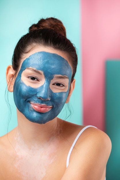 Portrait of a gorgeous woman using face mask