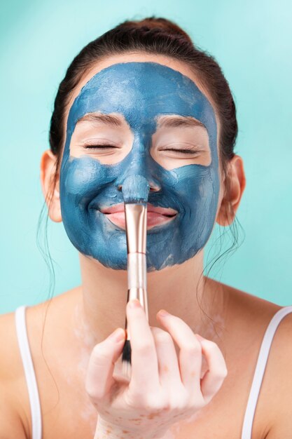 Portrait of a gorgeous woman using face mask