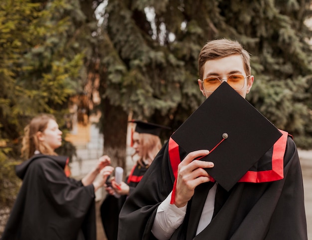 Free photo portrait graduated boy