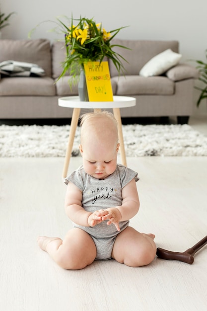 Free photo portrait of grandchild playing at grandmothers home