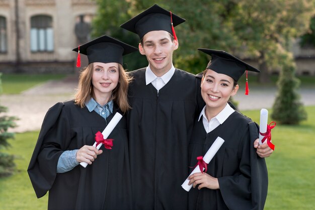 Portrait of group of students celebrating their graduation