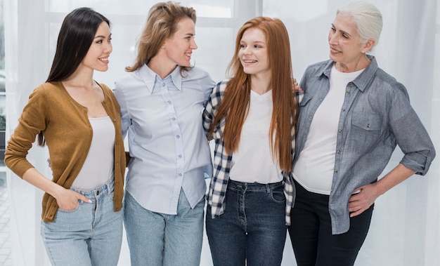 Portrait of group of women together smiling