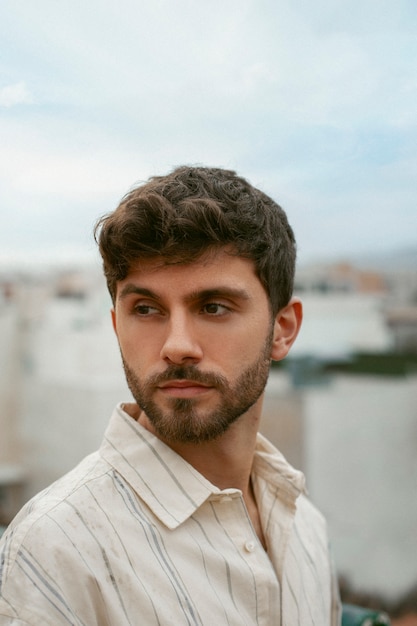 Portrait of handsome bearded man outside