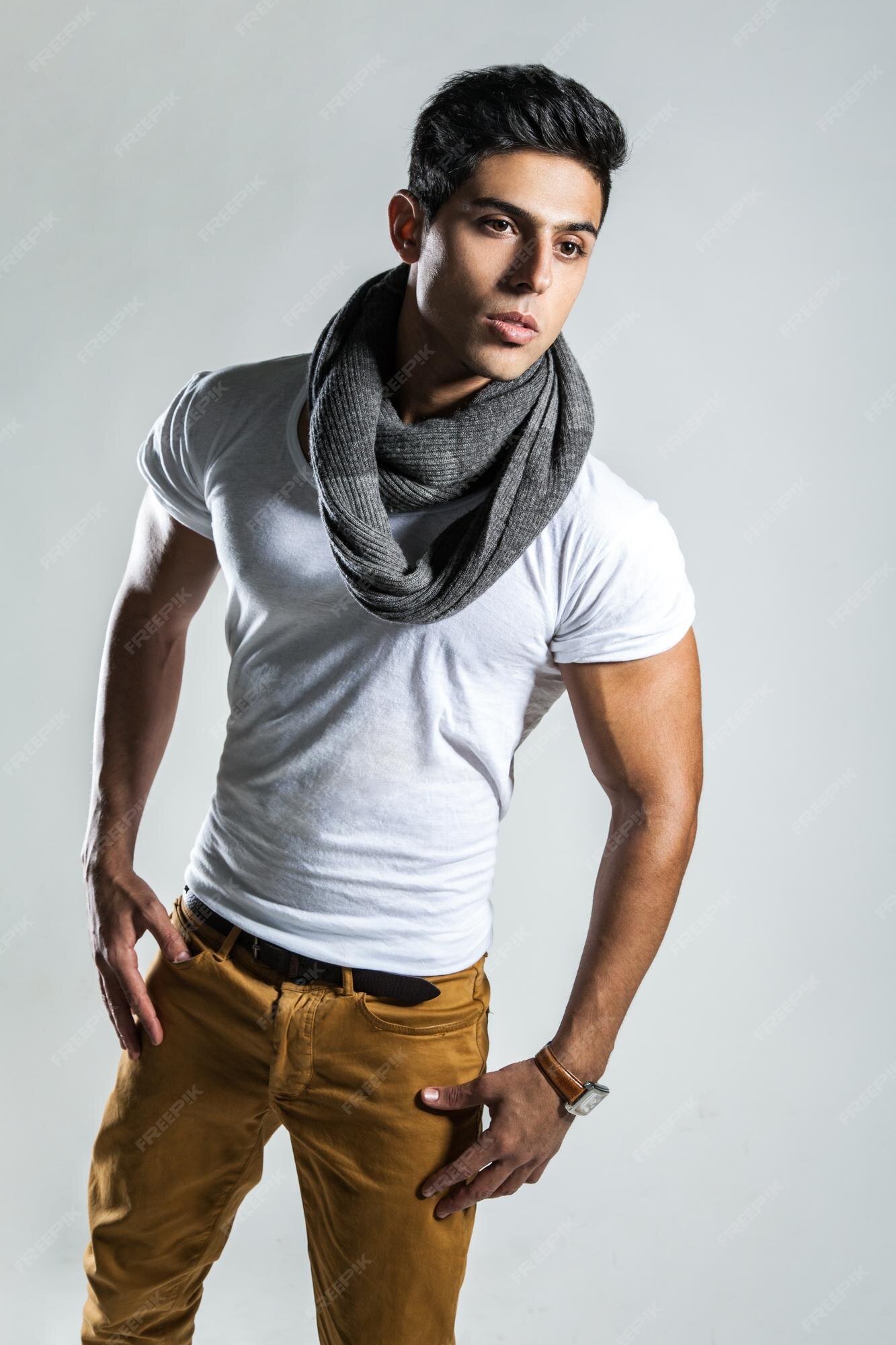 portrait-handsome-brunette-sexy-man-wearing-fashionable-white-tshirt-scarf-trousers-looking-away-with-confident-expression-indoor-studio-shot-isolated-gray-background_416530-16156.jpg