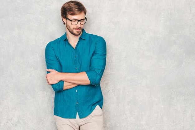 Free photo portrait of handsome confident hipster lumbersexual businessman model wearing casual jeans shirt clothes.