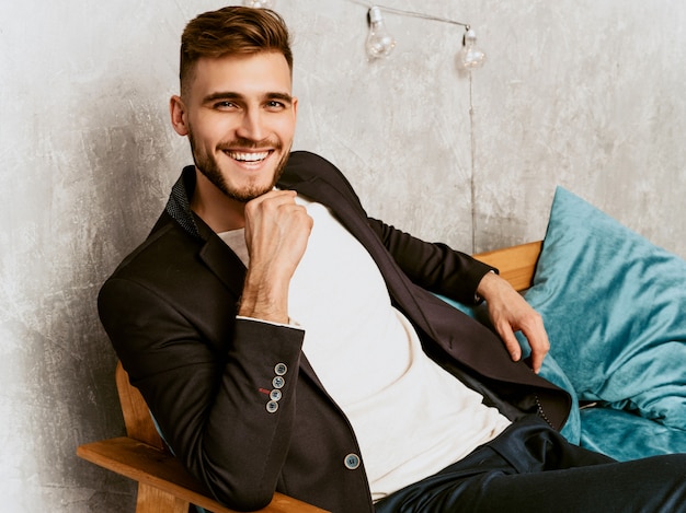 Free photo portrait of handsome hipster  businessman model wearing casual black suit.