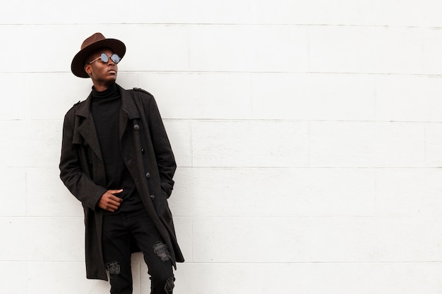 Portrait of handsome male posing with sunglasses