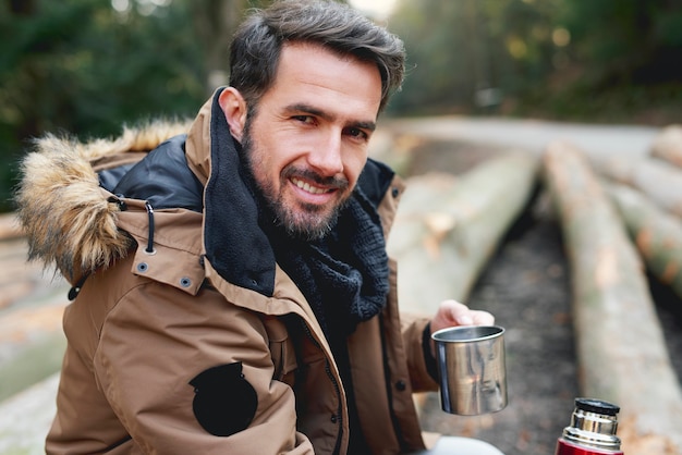 Portrait of handsome man in forest in wintertime