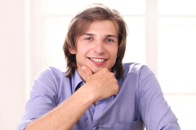 Portrait of handsome man in his office