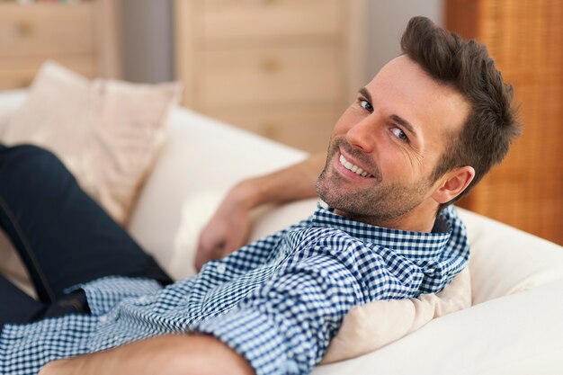 Portrait of handsome man at home