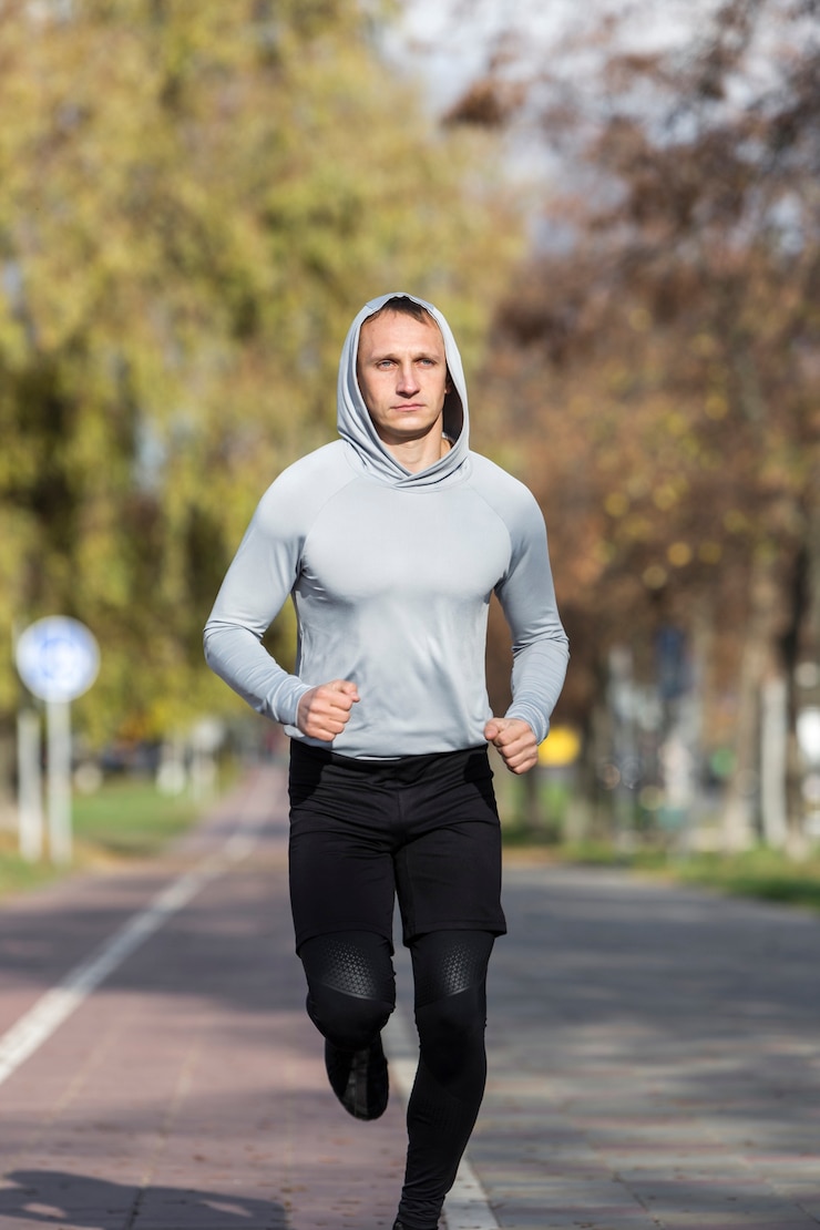 Free Photo portrait of handsome man jogging
