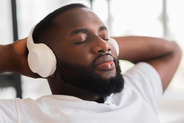 Portrait of handsome man listening to music