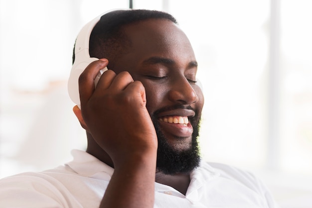 Portrait of handsome man listening to music