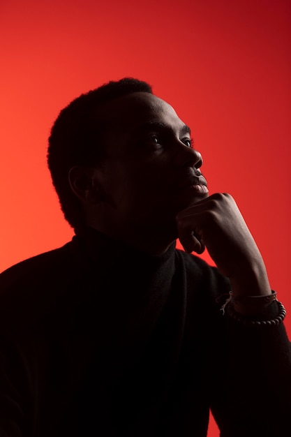 Portrait of handsome man over orange background