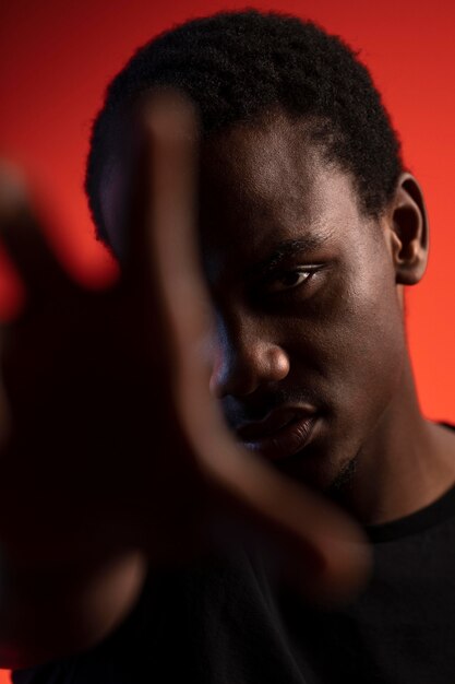 Portrait of handsome man over orange background