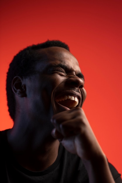 Portrait of handsome man over orange background