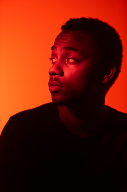 Free photo portrait of handsome man over orange background