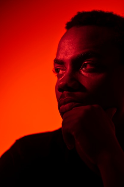 Portrait of handsome man over orange background